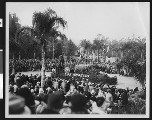 Float in parade depicting two oxen pulling a cart, ca.1932