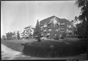 View of three large apartment buildings in an unknown location