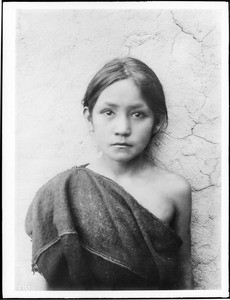 Young Hopi Indian girl standing outside, Oraibi, Arizona, ca.1900