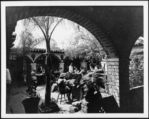 Outdoor restaurant with Spanish Colonial architecture