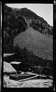 Family near what appears to be a mining site