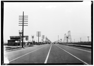 Whittier Boulevard near Montebello, showing the street marked off into four lanes for traffic, October 9, 1929