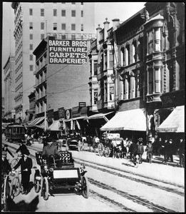 Spring Street looking north from Fourth Street with the Barker Brothers Furniture Building visible in the background, Los Angeles, ca.1905