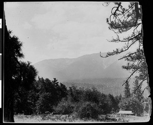 A panoramic view of a campsite in the mountains, ca.1930