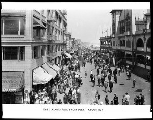 People strolling along the Long Beach Pike, just off the pier looking east, ca.1924