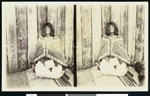 Composite image of a Walapai indian woman kneeling in a corner