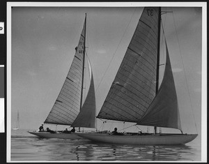 Close-up of two sailboats beside each other, ca.1940