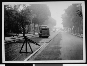 Paving machine during the construction of an unidentified street