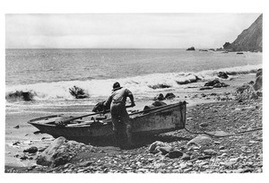 Portrait of a fisherman launching his skiff into the surf at Avalon bay, ca.1900