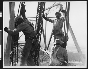 Bureau of Power and Light workmen assembling a B.C. transmission tower, ca.1930