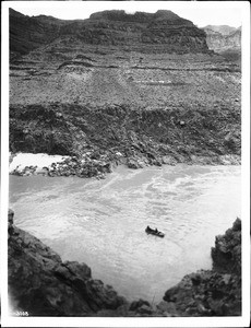 Distant view of the Bass Ferry halfway across the Colorado River, Grand Canyon, ca.1900-1930
