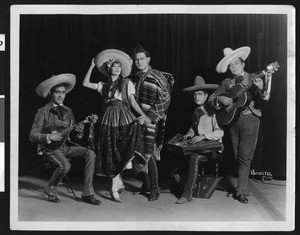 Mexican American band and two dancers, ca.1920