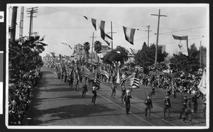 Military men marching in the Pasadena Rose Parade, ca.1926