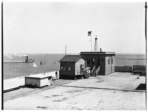 View of the Marine Exchange building on the roof of a warehouse in San Pedro