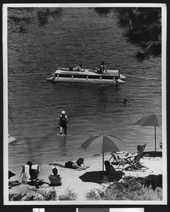 People sunbathing in Lake Arrowhead, ca.1950