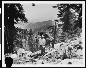 A man with a pack horse in the mountains, ca.1930