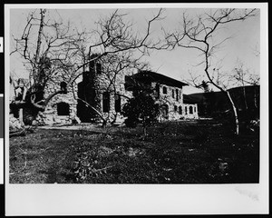 Exterior view of Charles F. Lummis's rock home "El Alisal", ca.1898-1910