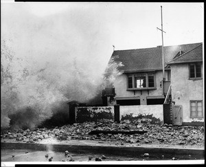 Unidentified house in Redondo Beach being pummeled by breaking surf, ca.1953