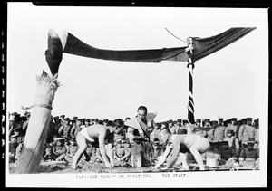 Japanese sumo wrestlers at the beginning of the match