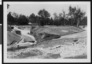 Flooding, showing damage to a road, ca.1930