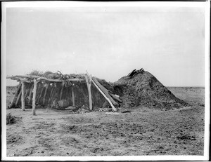 Navajo Indian hogan with ramada, ca.1900