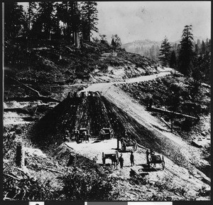 Horse-drawn carts being used for construction on a segment of Southern Pacific Railroad in a mountainous region, ca.1860