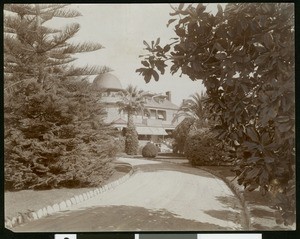 Exterior view of the Andrew McNally residence, shown from a nearby path, Altadena