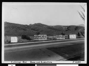 Large boxes on the side of Cahuenga boulevard to advertise Sprigg Moving and Storage Company, September 1936