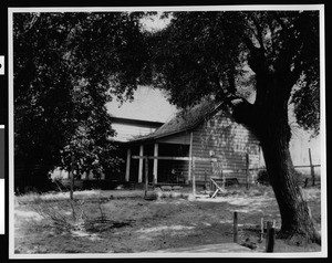 Exterior view of an adobe with new jacketing, Bakersfield, 1938