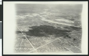 Aerial view of flooding near the San Gabriel River and the fork of the Rio Hondo River, ca.1930