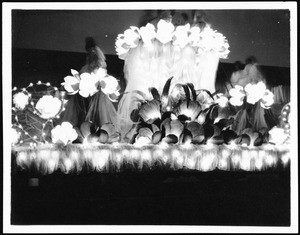 Panama-Pacific International Exposition night float, showing women on a flowery float, San Francisco, 1915