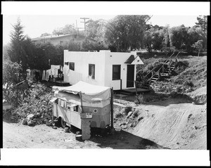 View of houses to be affected by a filling operation on the corner of Barrington Avenue and Dorothy Street in Westwood, October 26, 1938