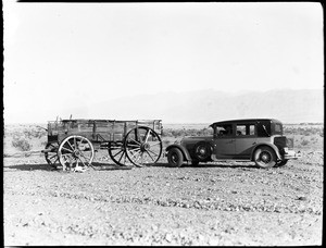 Wagon next to an automobile