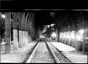 Interior view of the snow sheds of Southern Pacific (or Union Pacific?) Railroad at Cisco, 1909