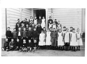 Class of schoolchildren in front of the schoolhouse in Monrovia, ca. late 1880-early 1890's