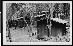 Exterior view of cabins on a hill at Fern Lodge, ca.1930