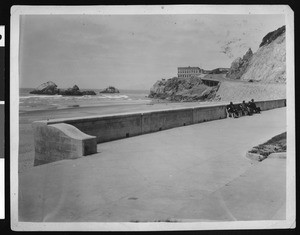 Distant view of the exterior of the Cliff House Restaurant and Seal Rocks in San Francisco, ca.1900