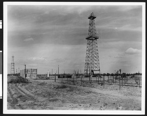 Derrick standing tall at Mount View Oil Field's Dana Hogan Discovery Well in Kern County, ca.1920