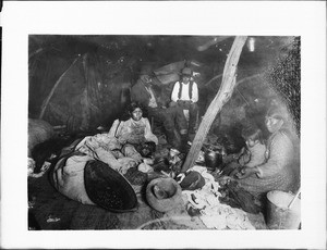 Interior of Paiute Indian house showing family, Yosemite Valley, ca.1900