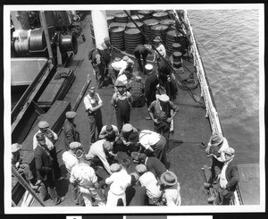 Stevedores playing craps on a boat called "Los Angeles", 1928