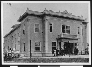 Halftone print depicting men posing outside the Turnverein Club on Figueroa Street, September 3, 1905