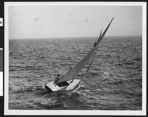 Lone man riding his sailboat through choppy waters, ca.1940