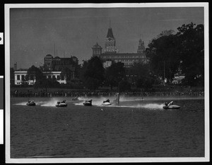 Oakland's Lake Merritt boat racing, with Hotel Oakland in the background, ca.1920