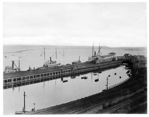 View of San Pedro Harbor, showing the depot and Dead Man's Island in the background, Los Angeles, ca.1898