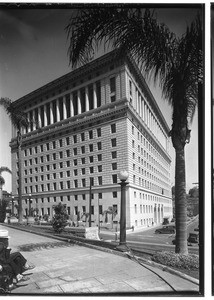 Exterior view of the Hall of Justice, showing a sidewalk in the foreground