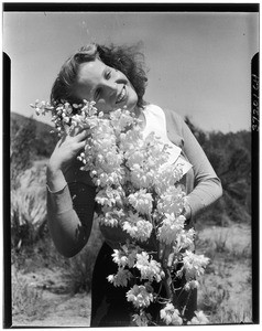 Woman posing with a wild bouquet