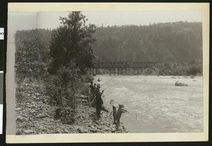 Boys fishing for salmon on the Umpqua River in Oregon