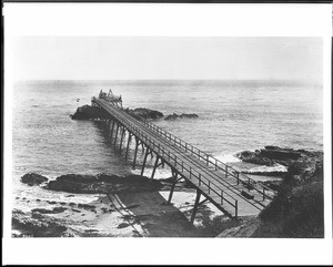 Hilltop view of the Laguna Beach pier, looking towards the ocean, ca.1901