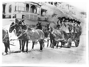 Horse-drawn wagon, the Friday Morning Club float, decorated with flowers for La Fiesta de Los Angeles, ca.1901 (1920?)