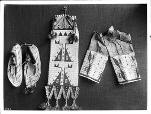 Collection of 3 pieces of Sioux Indian bead work on display, ca.1900